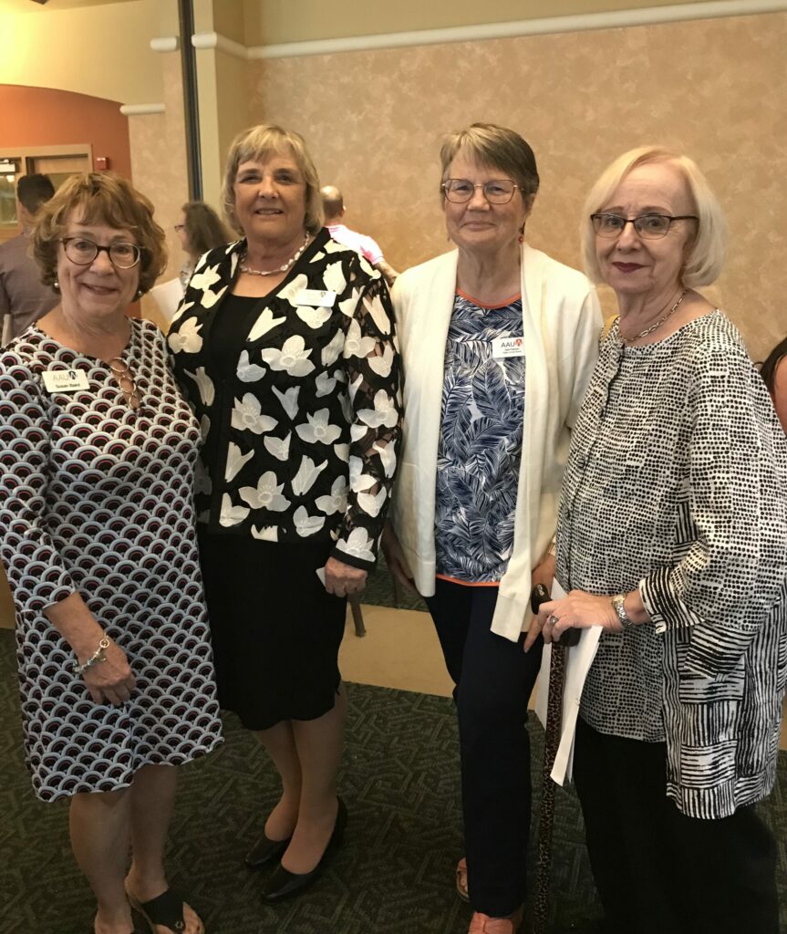 AAUW Flagler members Susan Baird, Gail Palmer and Ellie Bozzone flank Pat Ross (second from left.)